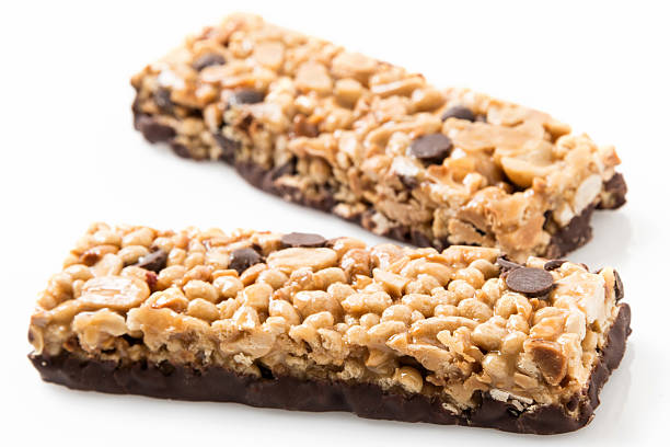 Chocolate and peanut butter energy bar close up on white background Chocolate and peanut butter energy bar close up on white background