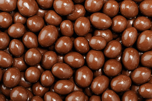 Stack of peanuts dipped in milk chocolate. Stack of peanuts dipped in milk chocolate.